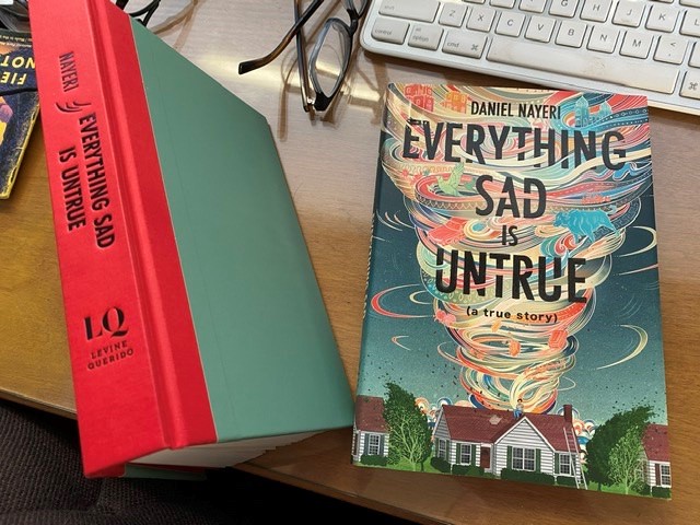 Everything Sad Is Untrue, both the unjacketed book and the dust jacket, separate, on my desk